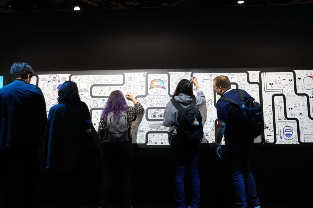 A group of people writing on a wall